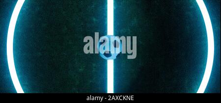 Il campo da calcio è stato ritagliato e visto dall'alto, con una palla al centro e linee luminose su sfondo scuro Foto Stock