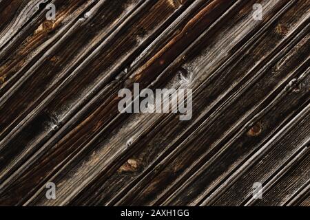 Quercia vecchia marrone scuro grunge naturale vintage legno sfondo.diagonale tavole. Foto Stock
