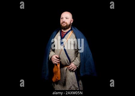 Uomo bearded sovrappeso a immagine di un mercante medievale Foto Stock