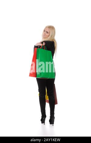 Bella ragazza bionda con borse per lo shopping Foto Stock