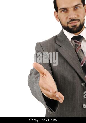 Felice sorridente giovane uomo d'affari che dà la mano per stretta di mano Foto Stock