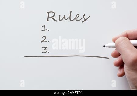 Regole scritte su whiteboard Foto Stock