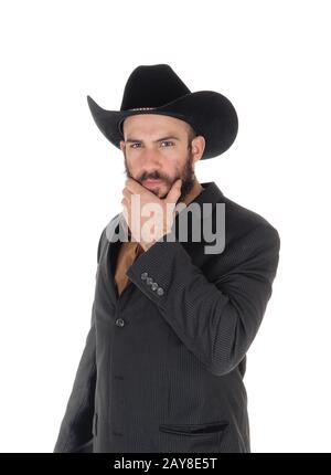 Uomo in giacca grigia e cappello da cowboy, mano sulla faccia Foto Stock