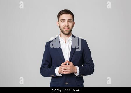 Il concetto di business - Ritratto bello Business man mano con volto fiducioso. Sfondo bianco. Foto Stock