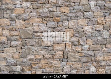 Decorativi ed irregolare della parete di pietra Foto Stock