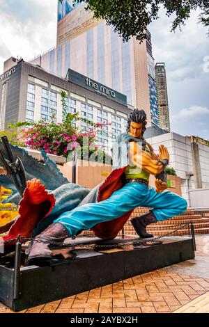 Hong Kong Avenue of Comic Stars, Kowloon Park. Skyline urbano sfondo Foto Stock