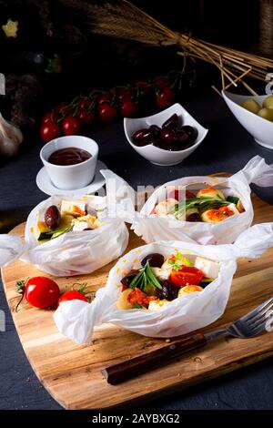 gnocchi al forno con pomodori zucchini e formaggio di pecora a dadini Foto Stock