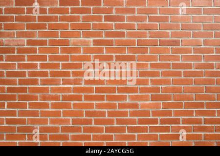 Muro di mattoni arancioni. Foto Stock