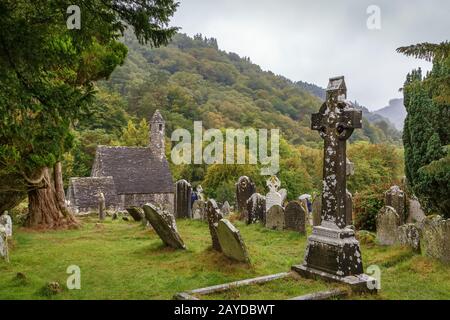 Croce celtica, Glendalough, Irlanda Foto Stock