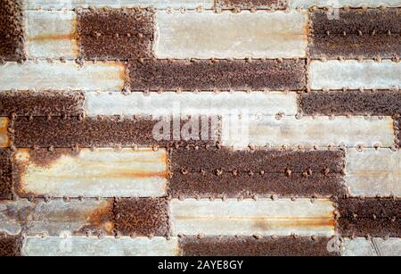 piastre di ferro saldate arrugginite come struttura Foto Stock