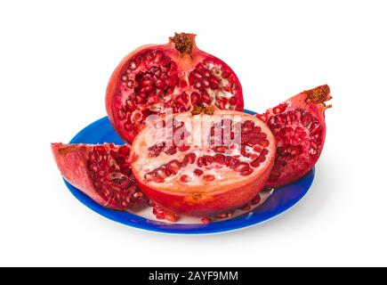 Melograno su piastra blu Foto Stock