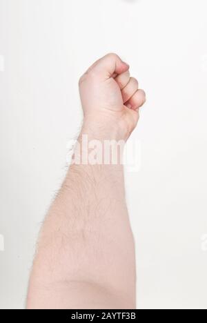 Pugno maschio su mano distesa Foto Stock
