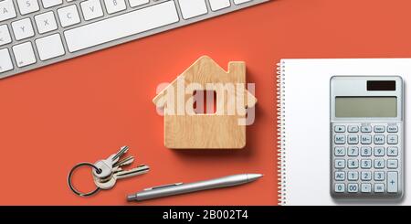 simbolo della casa su sfondo arancione con oggetti da ufficio Foto Stock