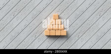 Blocchi di legno vuoti per il proprio testo formato come una piramide su sfondo di legno - 3D rappresentazione Foto Stock