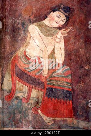 Thailandia: Il tabacco divenne popolare in Thailandia nel 19 ° secolo, murale a Wat Phumin, Nan, Thailandia del Nord. Wat Phumin fu costruito nel 1596 ed è famoso per il suo ubosoth cruciforme e ben conservato Tai Lue murales raffiguranti la vita quotidiana nel 19 ° secolo. Nan risale alla metà del XIV secolo e per gran parte della sua storia era un regno isolato. La città odierna si estende lungo la riva destra del fiume Nan. Foto Stock