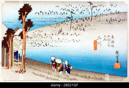 Giappone: 'Stazione Fifteen: Neve serale a Kanbara'. Ukiyo-e xilografia della serie '53 stazioni della strada Tôkaidô' di Utagawa Hiroshige (1797-1858), 1834 circa. Kambara: Un villaggio di montagna al calar della notte sotto la neve profonda, attraverso il quale tre persone si stanno affaticando, una con la testa sepolta in un ombrello mezzo aperto. Foto Stock