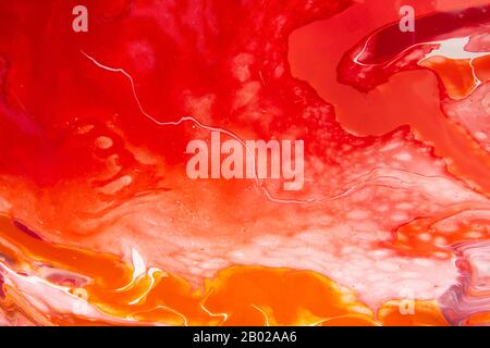 Spruzzi di vernice di colore rosso, giallo e bianco Foto Stock