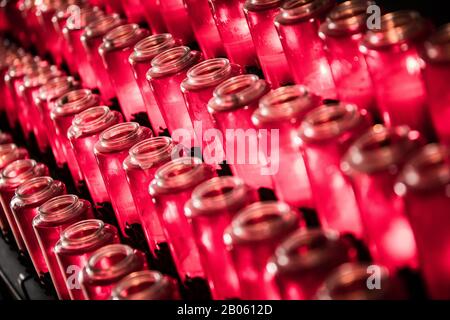 Red Catholic Mission Candles Red And Burning Foto Stock