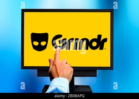 Logo Grindr sullo schermo Foto Stock