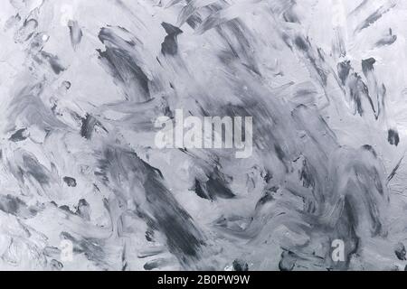 Sfondo in stile grunge. Texture grigia di tratti di pennello sulla parete, tela. Foto Stock