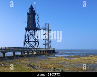 Faro di Oberersversand presso il porto di Dorum / Neufeld con bassa marea, costa Wurster, bassa Sassonia, Germania, Foto Stock