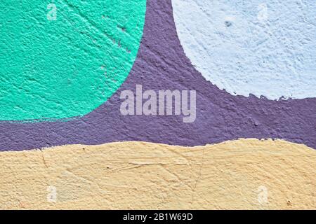 Intonaco astratto texture di verde, giallo e beige con una linea viola. Primo piano. Foto Stock