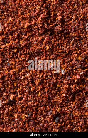 Greggio Rosso Organico Essiccato Sumac In Una Ciotola Foto Stock