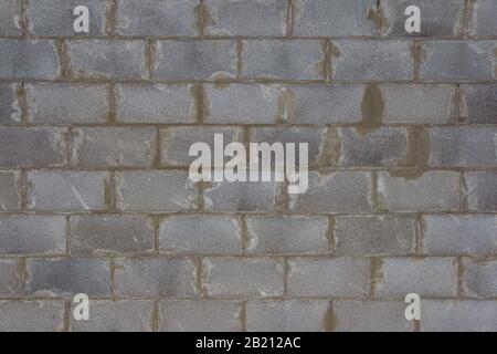 La parete è realizzata in blocchi di calcestruzzo autoclavati aerati. Costruzione di muri in mattoni Foto Stock