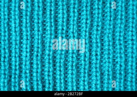 Closeup Tessitura Di Tessuto Di Lana Di Alpaca Blu Turchese In Motivi Verticali Foto Stock