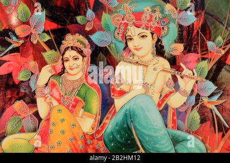 Krishna giocando il bansuri indiano (flauto) a Radha Foto Stock