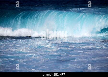 breaking waves crashing in the sea off the shoreline of Lanzarote canary islands spain Foto Stock