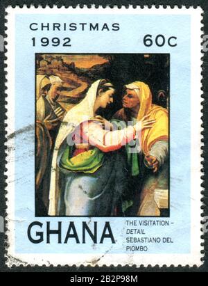 Ghana - CIRCA 1992: Un francobollo stampato in Ghana, numero di Natale, raffigura un frammento della Visitazione, di Sebastiano del Piombo, circa 1992 Foto Stock