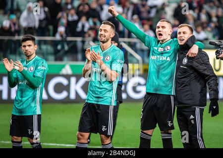 Andre Martins, Mateusz Wieteska, Artur Jedrzejczyk e Pawel Stolarski di Legia Warszawa celebrare dopo il PKO Ekstraklasa League match tra Legia Warszawa e Cracovia al Maresciallo Jozef Pilsudski Legia Warsaw Municipal Stadium.(Final Score; Legia Warszawa 2:1Cracovia) Foto Stock