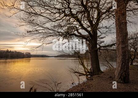 Tramonto sul lago a Clumber Park, Nottinghamshire Foto Stock