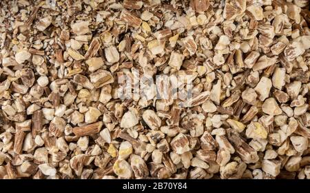 Radice di dente di leone o in latino Taraxaci radix sfondo. Erbe medicinali curative. Medicina alternativa Foto Stock