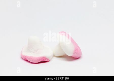 due funghi canditi in rosa e bianco Foto Stock