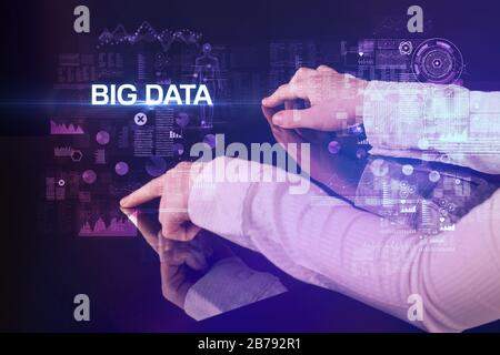 Uomo d'affari che tocca un enorme display con iscrizione AI BIG DATA, concetto di tecnologia moderna Foto Stock