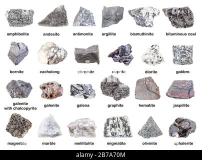 set di varie rocce grigie non lucidate con nomi (antimonite, cromite, grafite, melilitolite, bornite, galenite, sphalerite, magnetite, ematite, coppa Foto Stock