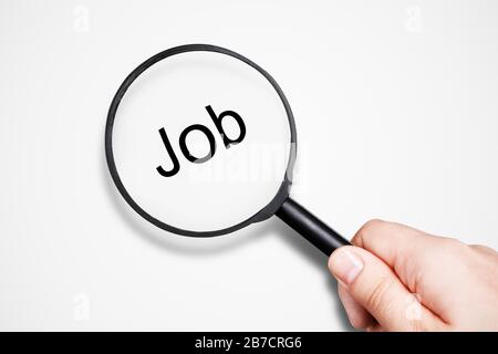 lente d'ingrandimento femmina di tenuta, concetto di ricerca di lavoro Foto Stock
