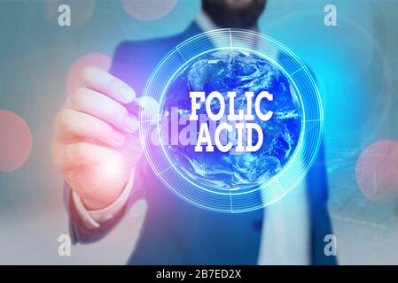 Testo per la scrittura a mano acido folico. Foto concettuale una vitamina del complesso B trovato in elementi vegetali verdi frondosi di questa immagine fornita dalla NASA Foto Stock