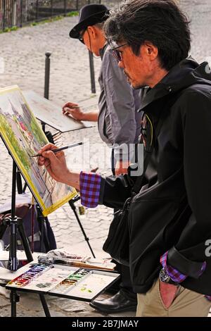 Artisti pittura su Parigi Francia strada Foto Stock