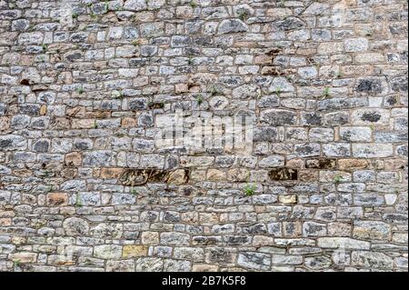 Parete di fondo piatta in pietra, fatta da blocchi di pietra di dimensioni irregolari a Eastern state Penitentiary, Philadelphia, Pennsylvania sfondo, carta da parati Foto Stock