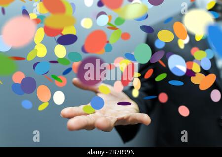 Primo piano di una persona che presenta la proiezione virtuale di confetti colorati Foto Stock