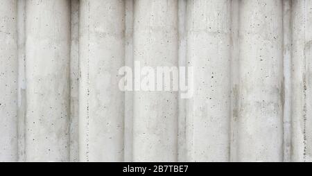 muro di cemento grigio a forma di colonne Foto Stock