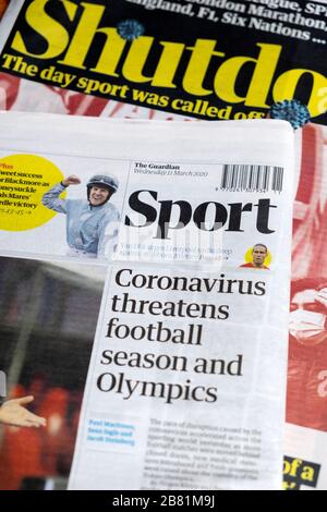 Chiusura Sezione Sport blocco 'Coronavirus minaccia la stagione calcistica e le Olimpiadi' sui giornali Guardiani Marzo 2020 Londra Inghilterra UK Foto Stock