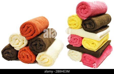Rotoli di asciugamani multicolore isolati su sfondo bianco Foto Stock