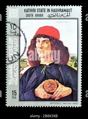 Francobollo cancellato stampato dallo Stato di Kathiri ad Hadhramaut, che mostra dipinti di Botticelli, circa 1972. Foto Stock