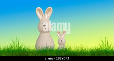 due conigli pasquali si trovano su un prato con sfondo pastello Foto Stock