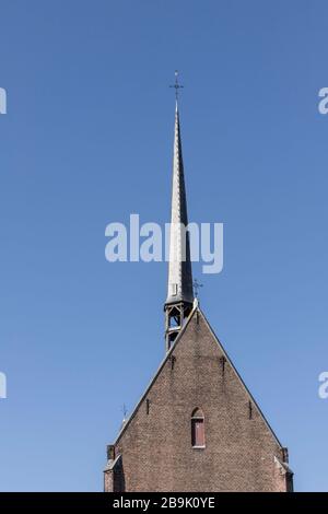 Gent, Belgio - 22 marzo 2020: Torre della Chiesa nel beghinaggio di Santa Elisabetta. Patrimonio mondiale dell'UNESCO Foto Stock