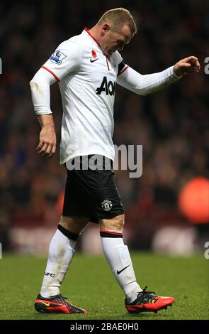 Wayne Rooney del Manchester United lotta dopo aver raccolto un infortunio Foto Stock